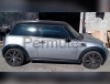 Permuto Mini Cooper bicolor con Camper